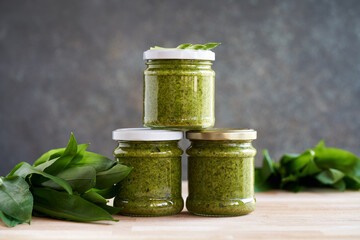 Bottled wild garlic pesto with fresh ramson leaves