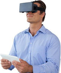 Businessman holding tablet while wearing vr glasses