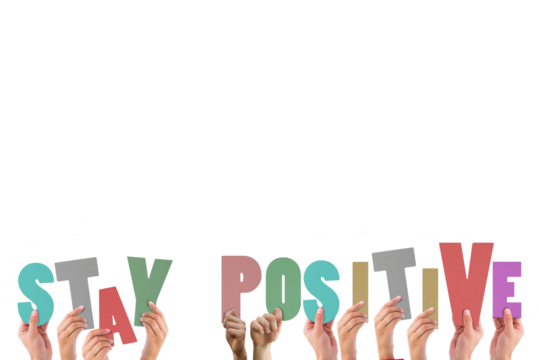 Colorful alphabet spelling stay positive held up by people 