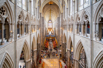 Nave of Westminster Abbey with Gothic style. The church is located next to Palace of Westminster in city of Westminster in London, England, UK. This church is UNESCO World Heritage Site since 1987.  - obrazy, fototapety, plakaty