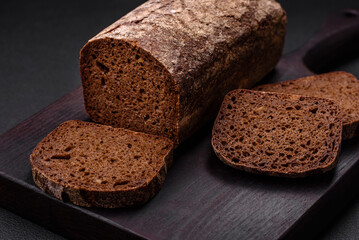 Loaf of fresh crispy brown bread with grains and seeds