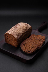 Loaf of fresh crispy brown bread with grains and seeds