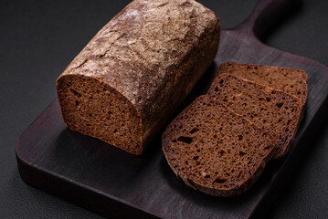 Loaf of fresh crispy brown bread with grains and seeds