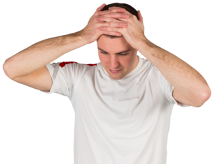 Disappointed football player looking down