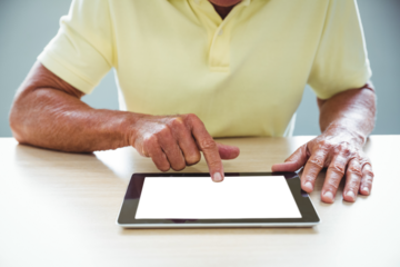 Senior man using a digital tablet