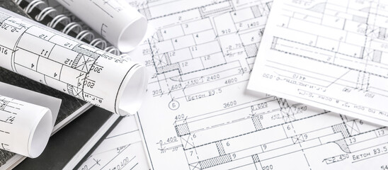 Architects concept, engineer architect designer freelance work on start-up project drawing, construction plan architect design working drawing sketch plans blueprints and making construction model