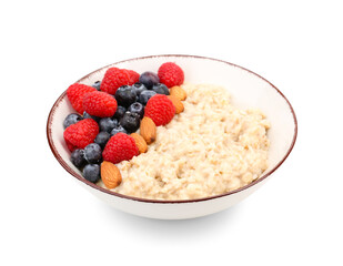 Bowl with tasty oatmeal, raspberries, blueberries and almonds isolated on white background