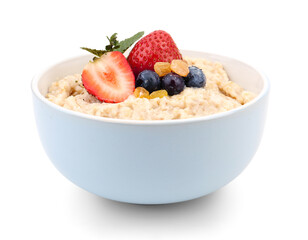 Bowl with tasty oatmeal, raisins, strawberry and blueberries isolated on white background