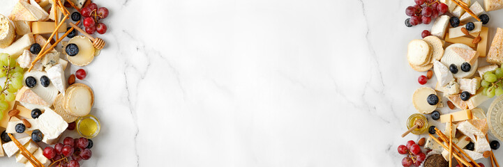 Cheese banner, assortment of traditional cheese, brie, gorgonzola, lambert, livaro, raclette. Antipasto, corner border, copy space. Marble white background, top view. - obrazy, fototapety, plakaty