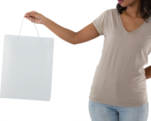Mid section of woman holding shopping bag