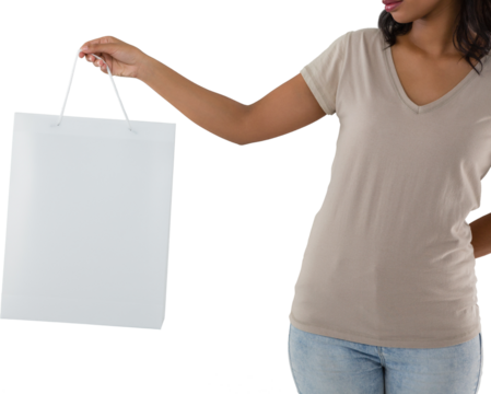 Mid section of woman holding shopping bag