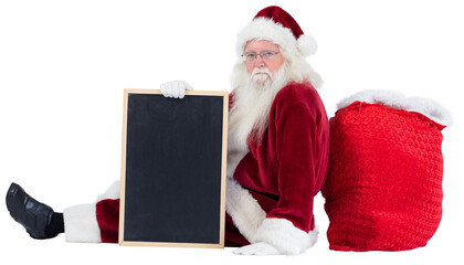 Santa sits leaned on his bag with a board