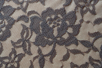 Detail of a beige women blouse made of guipure fabric, closeup