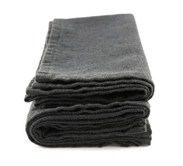 Black folded napkins on white background