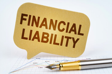 On the business diagram is a pen and a sign with the inscription - Financial Liability