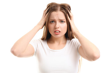 Worried young woman with hair loss problem on  white background