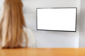 Unrecognizable young woman watching TV with black white screen at home