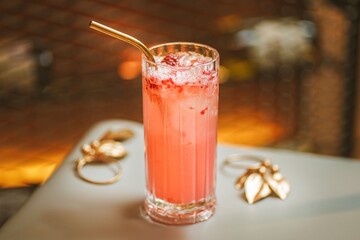 Side View of Raspberry Bellini: Delightful Pink-Peach Fizz, Elegant Cocktail, Fresh Raspberry Garnish, Bubbly Indulgence, Sophisticated Taste, Festive Celebration, Cheerful Atmosphere