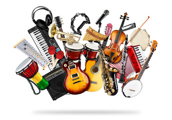 stack pile collage of various musical instruments. Electric guitar violin piano keyboard bongo drums tamburin saxophone, and trumpet. Brass percussion studio music concept isolated white background