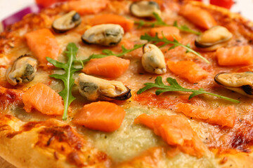Tasty seafood pizza on table, closeup