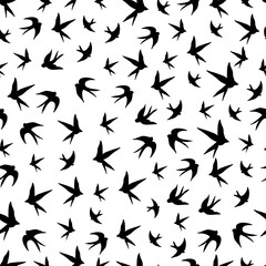 Swallows birds black silhouette on white background seamless fabric design pattern