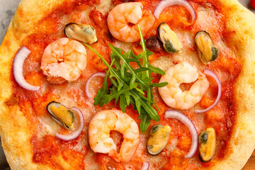Tasty seafood pizza on table, closeup