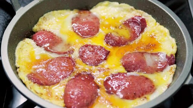Sucuk and egg is a popular Turkish breakfast dish made by combining slices of sucuk (a type of spicy sausage) and scrambled eggs.