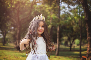 Girl in white dress, fairy tale princess, copy space, children's day theme. © Alfredo Hernández