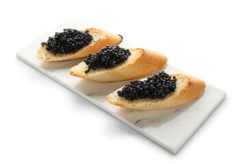 Tasty bruschettas with black caviar on white background