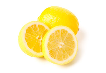 Whole and cut fresh lemons on white background