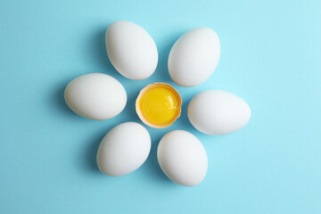 fresh farm chicken eggs on a colored background