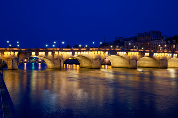 Fototapeta na wymiar View of the Pont Neuf across the river Seine in Paris, France.