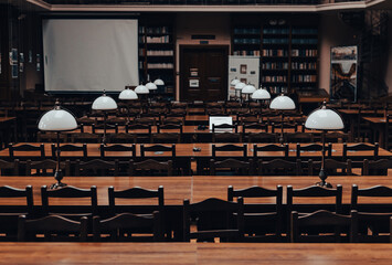 Calm interior of an empty reading hall of a university library - 592071461