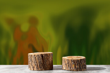 Two wooden round saw cuts on a fantasy green-brown background. Natural podiums for advertising cosmetic products and body care. Nature concept.