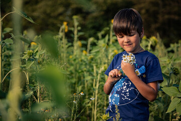 child with a small bouquet of flowers