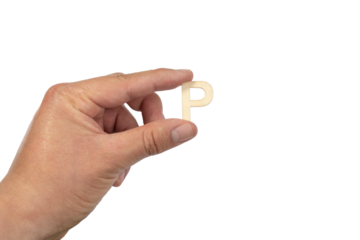 A hand holding a wooden letter p in front of a white background