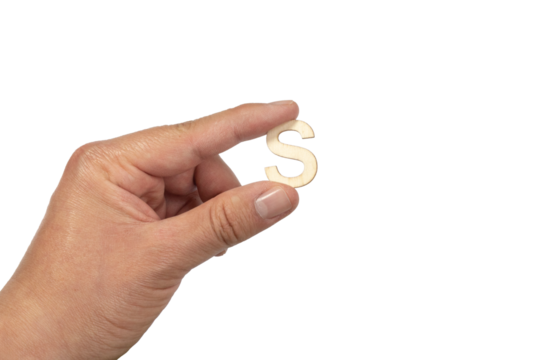 Unrecognizable person holding a letter s on a white background