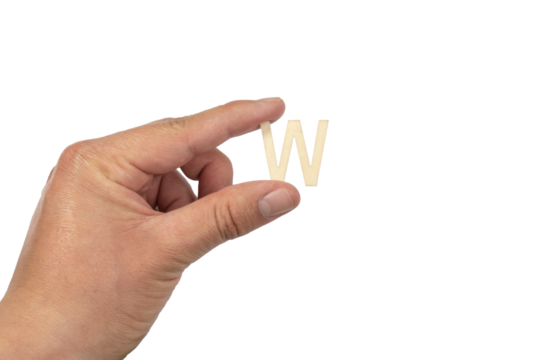 Unrecognizable person holding a letter w on a white background
