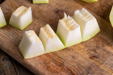 Ripe sweet melon pulp divided into small pieces