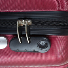 Close-up of zipper with code lock. Safety of things in a travel bag