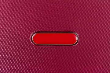 Close-up of plastic texture with oval red label