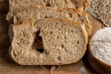 A loaf of bread made of wheat and rye flour cut into pieces