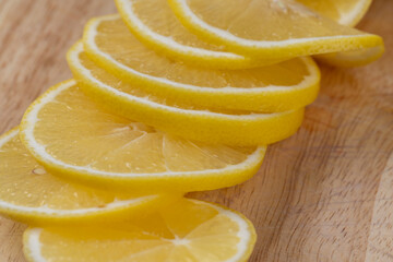 Yellow ripe lemon cut into slices