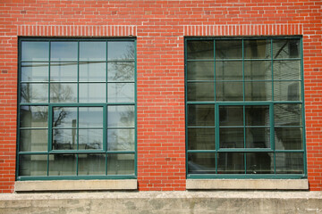 Old brick buildings are a symbol of industrial heritage, innovation, and hard work. They represent the industrial revolution and the rise of manufacturing and industry