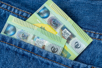 one hundred euro cash close up in pants