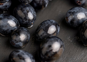 washed ripe black grapes covered with drops of water