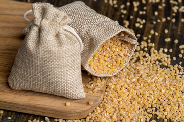 Not cooked wheat porridge in a linen bag