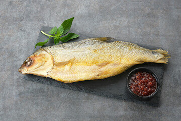 Bandeng Presto or Milkfish with high pressure cooked, served with chilli sauce (sambal), Indonesian food
