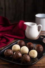 Delicious chocolate truffles on the table.