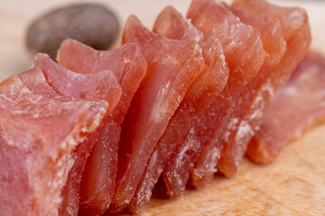 Square chicken fillet sausage, close up